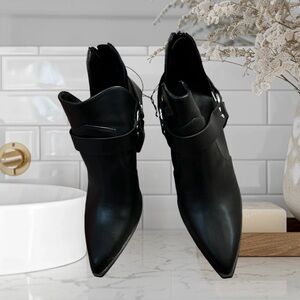 Forever 21 faux leather booties featuring an ankle length, pointed toe boot